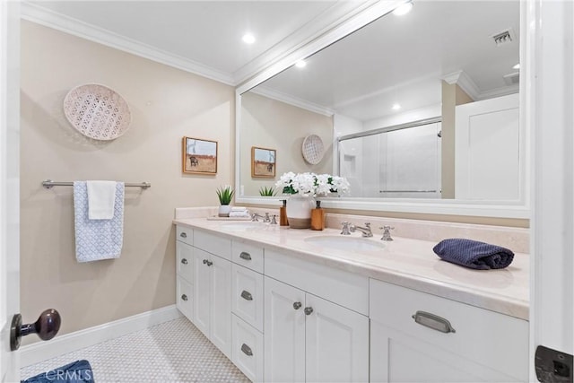 bathroom featuring a shower stall, visible vents, a sink, and ornamental molding