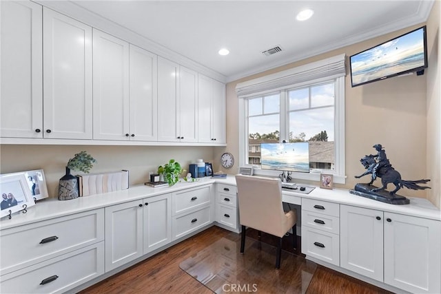 office featuring crown molding, built in desk, recessed lighting, visible vents, and dark wood-type flooring