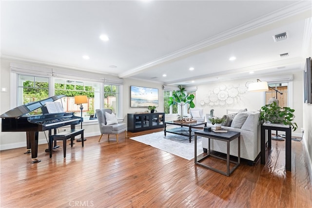 living room featuring beamed ceiling, wood finished floors, visible vents, and crown molding