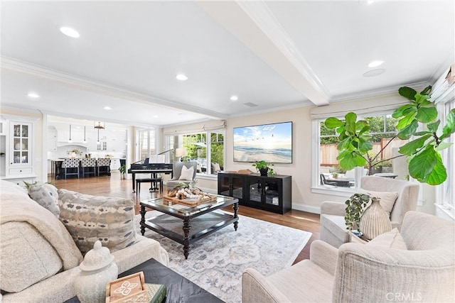 living room featuring recessed lighting, wood finished floors, baseboards, beam ceiling, and crown molding