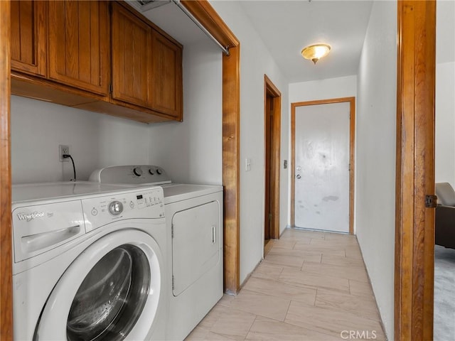 laundry area featuring cabinet space and washer and clothes dryer