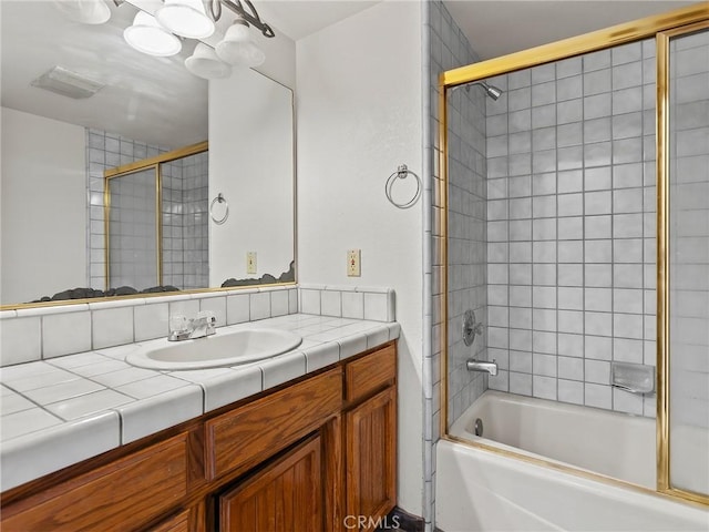 bathroom with vanity and shower / bathing tub combination