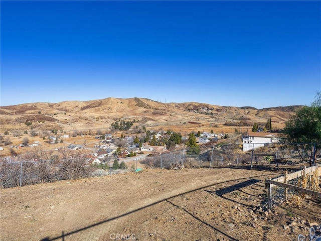 property view of mountains featuring a residential view