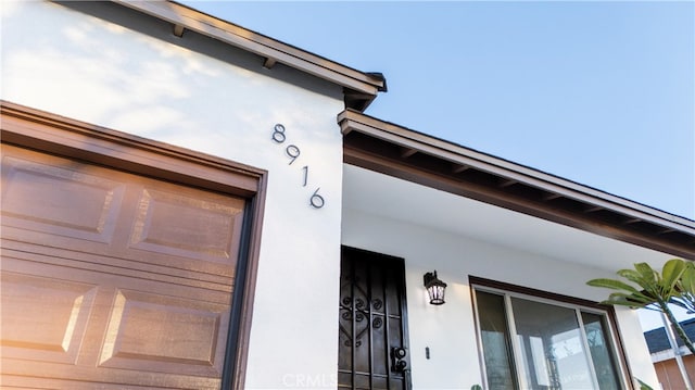 exterior details featuring stucco siding