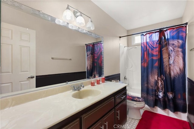 full bath with shower / bath combo, vanity, and toilet