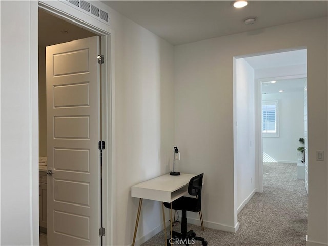 hall with carpet floors, recessed lighting, and baseboards