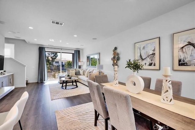 dining room featuring baseboards, visible vents, dark wood-type flooring, and recessed lighting