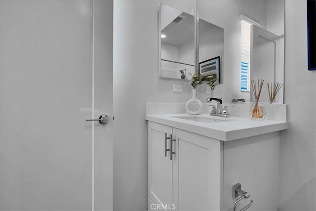 bathroom with visible vents and vanity