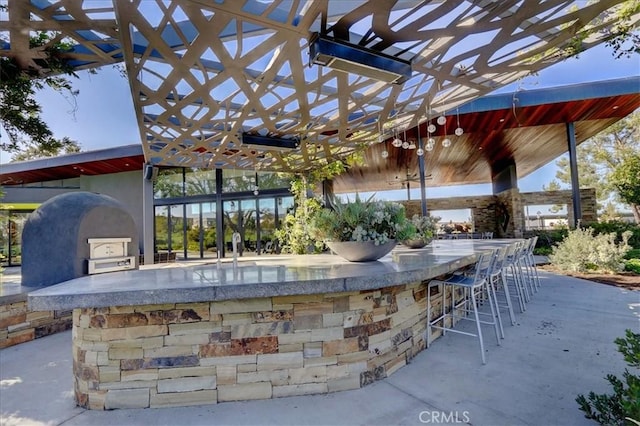 view of patio / terrace featuring exterior bar