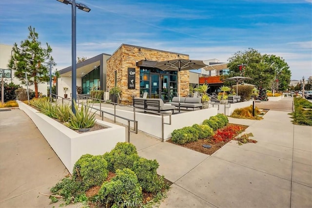 view of home's community with outdoor lounge area