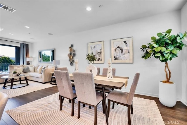 dining area with recessed lighting, dark wood-style flooring, visible vents, and baseboards