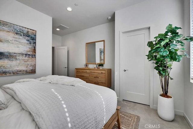 bedroom with recessed lighting, light colored carpet, and baseboards