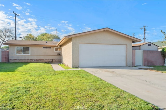 single story home featuring a garage, fence, a front lawn, and stucco siding