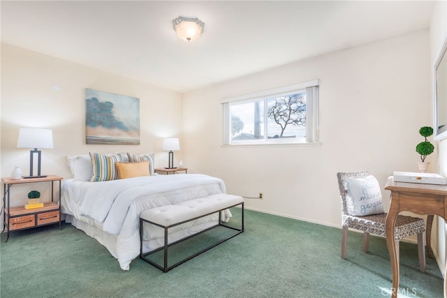 bedroom featuring carpet floors and baseboards