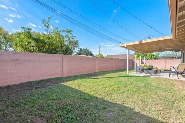 view of yard with a fenced backyard and a patio