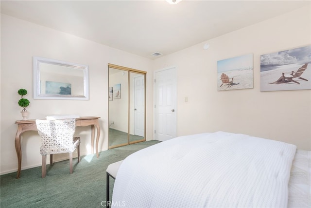 carpeted bedroom with a closet and visible vents