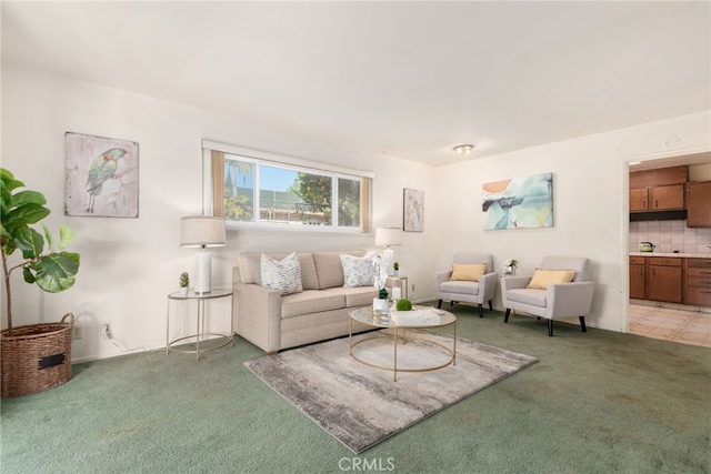 living area featuring light colored carpet