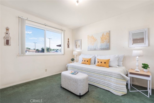 carpeted bedroom featuring baseboards