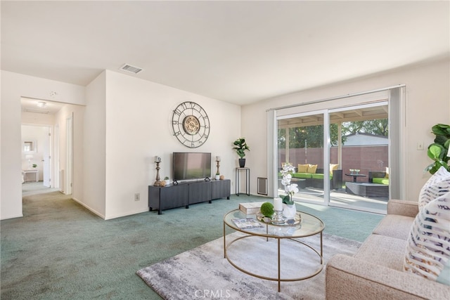 living room featuring carpet floors and visible vents