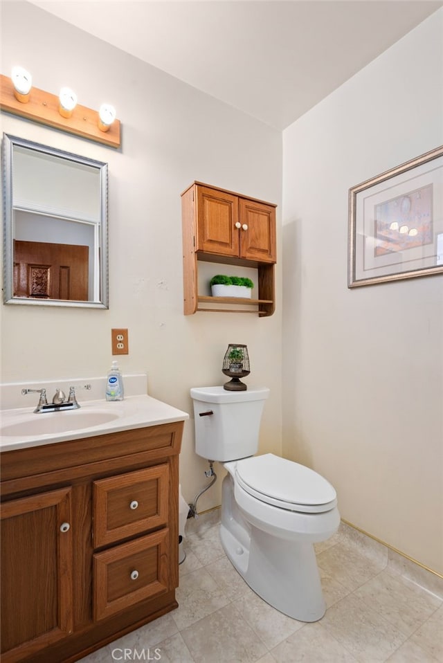 half bath featuring toilet and vanity