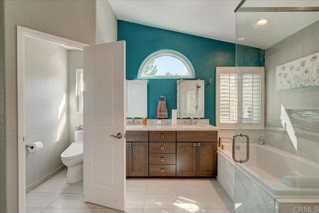 full bathroom featuring double vanity, toilet, a bath, tile patterned floors, and a sink