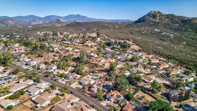 birds eye view of property with a residential view and a mountain view