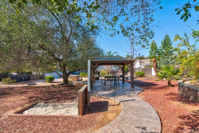 view of yard featuring fence and a gazebo