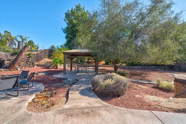 exterior space with fence and a gazebo