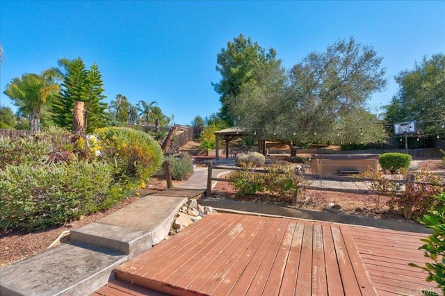 wooden terrace with fence and a gazebo