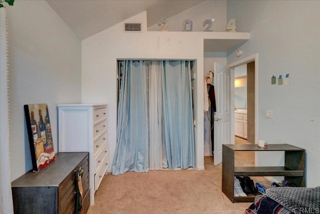 bedroom with light carpet, visible vents, and lofted ceiling