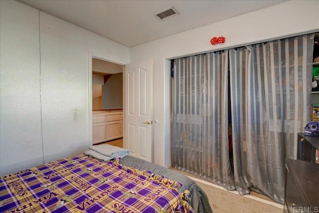 bedroom featuring visible vents and carpet flooring