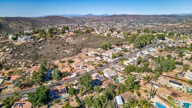 birds eye view of property with a residential view and a mountain view