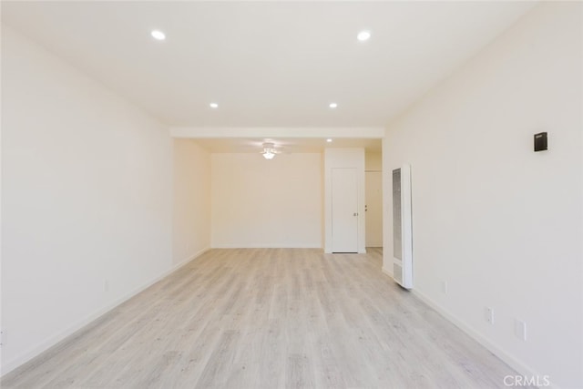 unfurnished room featuring recessed lighting, baseboards, and light wood finished floors