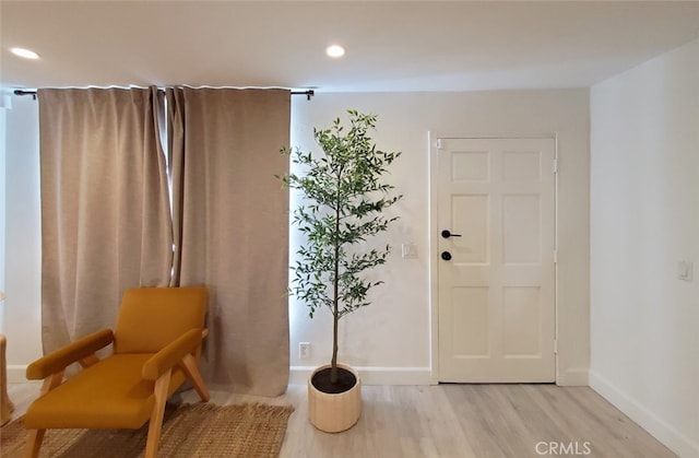 entryway featuring recessed lighting, baseboards, and light wood-style flooring