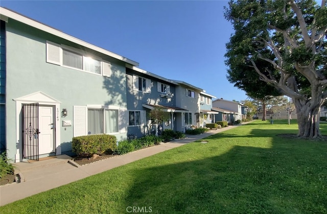 exterior space with a yard and a residential view