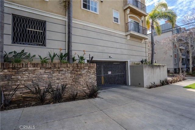 3401 S Bentley Ave Unit 306, Los Angeles, CA 90034 - view of side of property with stucco siding and a balcony