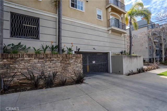 3401 S Bentley Ave Unit 306, Los Angeles, CA 90034 - view of home's exterior with stucco siding and a balcony