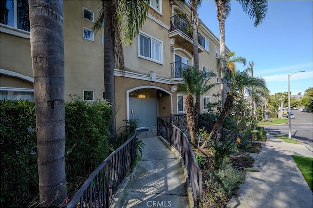 3401 S Bentley Ave Unit 306, Los Angeles, CA 90034 - doorway to property featuring stucco siding