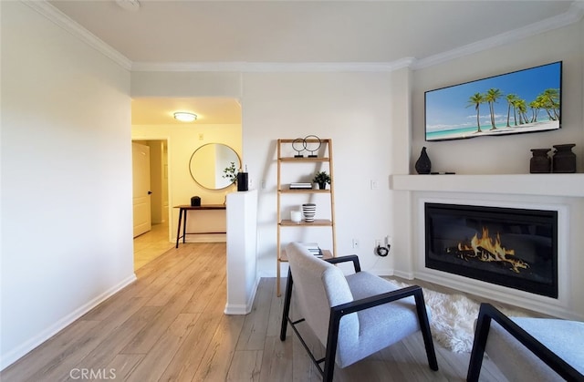3401 S Bentley Ave Unit 306, Los Angeles, CA 90034 - living area featuring ornamental molding, light wood finished floors, a glass covered fireplace, and baseboards