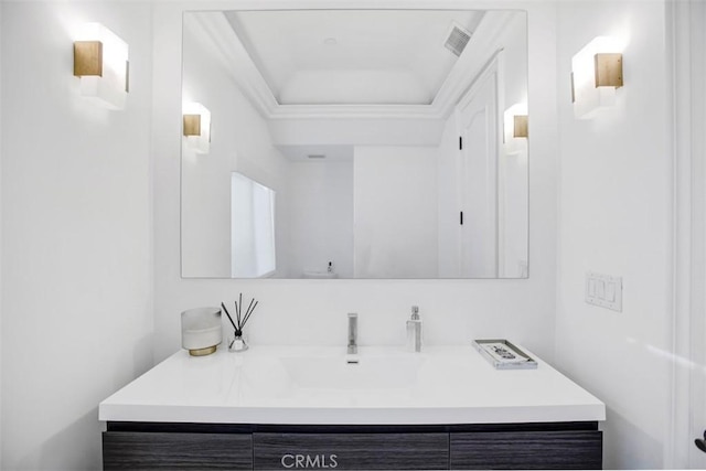 bathroom with toilet, visible vents, and vanity