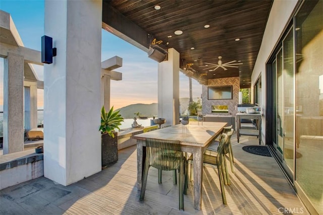 view of patio featuring ceiling fan and outdoor dining area