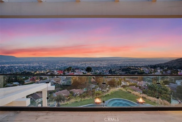 view of balcony at dusk