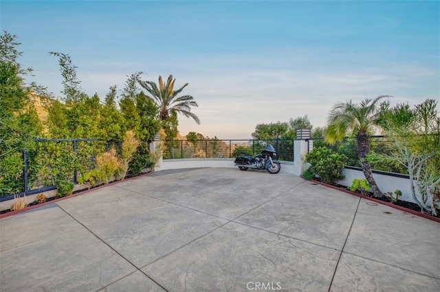 patio terrace at dusk with fence