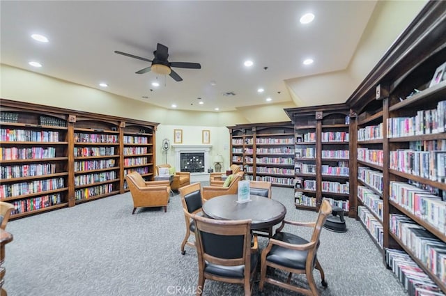 interior space with recessed lighting, a fireplace, and a ceiling fan