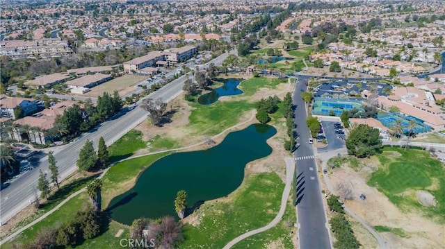 aerial view featuring a water view, a residential view, and golf course view