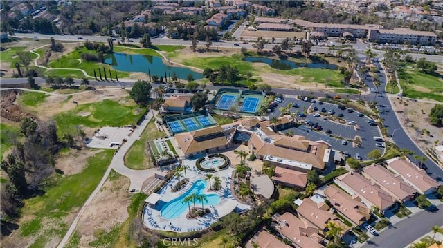 birds eye view of property with a residential view and a water view