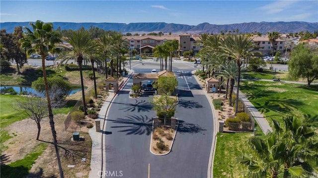 bird's eye view featuring a residential view and a water and mountain view