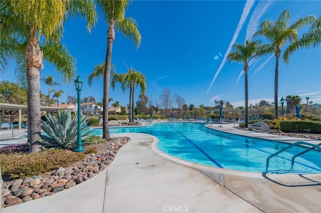 community pool with a patio area