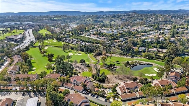 birds eye view of property featuring a residential view, a mountain view, and golf course view