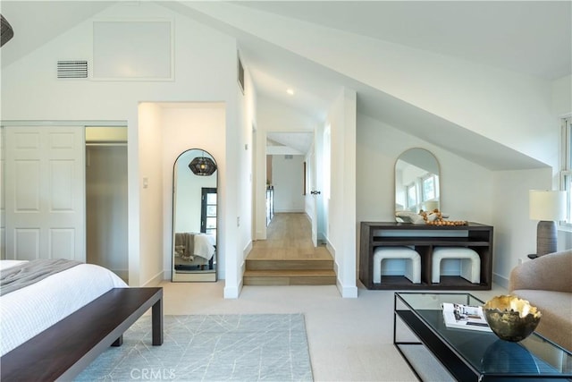 carpeted bedroom featuring visible vents, baseboards, and high vaulted ceiling